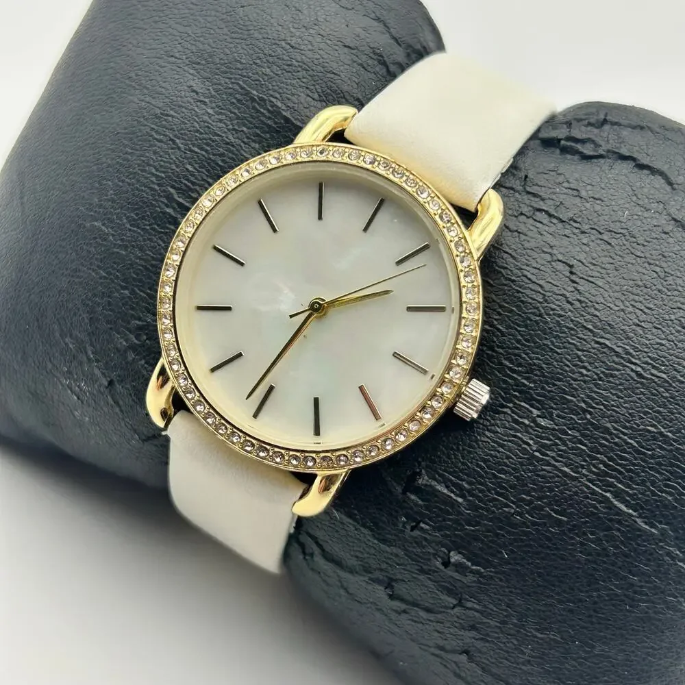 Women’s Gold-tone Crystal Bezel Mother Pearl Dial White Band Minimalist Watch